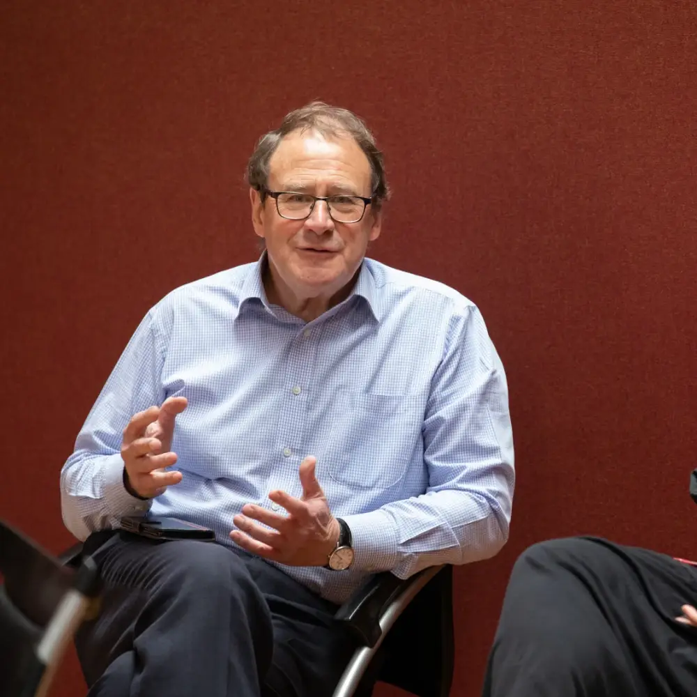 Two members of the IntoOpera team seated together during a creative discussion.