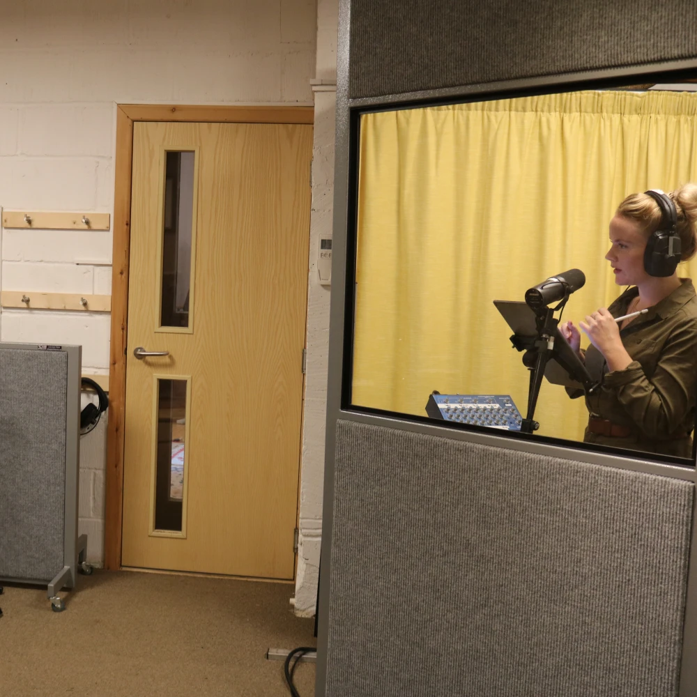 Opera performers recording together in a professional studio